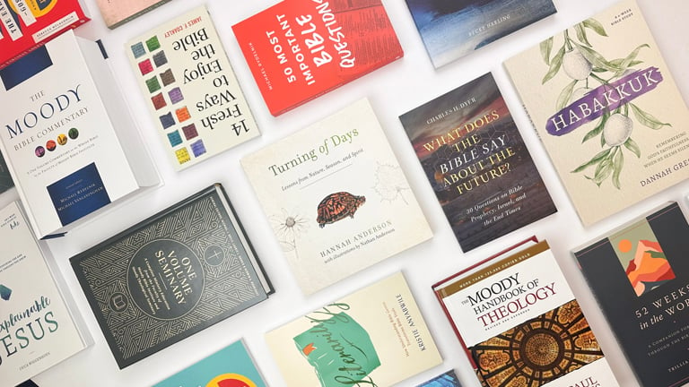 A flat lay of Christian books from Moody Publishers.